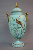 A LATE VICTORIAN TURQUOISE GLASS TWIN HANDLED BALUSTER VASE AND COVER, gilt handles and finials, the