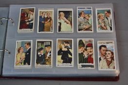 A CIGARETTE CARD ALBUM, containing loosely inserted cards all featuring Film Stars, mixture of