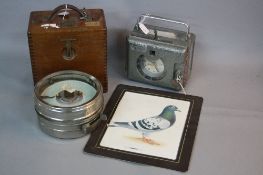 TWO TOULET PIGEON CLOCKS, an Imperator, in fitted wooden case and a Super, not tested, with a framed