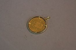 A GOLD 10 GUILDERS 1912, Netherlands, the coin is loosely mounted .900 fine AE/F