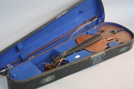 A HEINRICH SCHWARZ VIOLIN, with paper label Leipzig 1884, with a bow, in wooden case, all in need