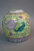 A CHINESE YELLOW GROUND GINGER JAR, painted with large blooms between geometric borders, red seal