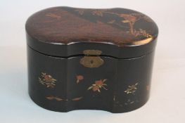 A LATE 19TH CENTURY JAPANESE BLACK LACQUERED TWO DIVISION TEA CADDY, shaped oval outline,