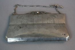 AN EARLY 20TH CENTURY RUSSIAN SILVER EVENING PURSE, on a short chain, cast scrolled clasp,