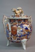 A LATE 19TH CENTURY JAPANESE IMARI PORCELAIN KORO, the circular cover with dog of fo finial