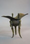 A 19TH CENTURY CHINESE BRONZE ARCHAIC STYLE RITUAL WINE VESSEL, helmet form bowl, Greek Key band, on