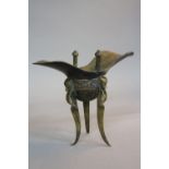 A 19TH CENTURY CHINESE BRONZE ARCHAIC STYLE RITUAL WINE VESSEL, helmet form bowl, Greek Key band, on