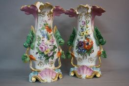 A PAIR OF MID 19TH CENTURY CONTINENTAL PORCELAIN VASES, of baluster outline, wavy rims above