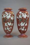 A PAIR OF LATE 19TH CENTURY GLASS BALUSTER VASES, white opaque interiors, the exterior with a