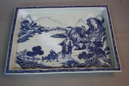 A LATE 19TH CENTURY JAPANESE BLUE AND WHITE DECORATED EARTHENWARE TRAY, of rectangular form (