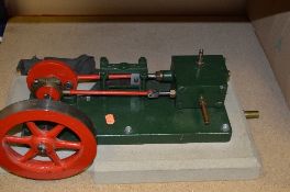 A HORIZONTAL SINGLE CYLINDER LIVE STEAM STATIONARY ENGINE, not tested, no makers markings,