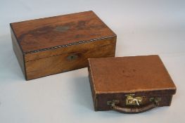 A VICTORIAN MAHOGANY AND EBONISED WRITING SLOPE, of rectangular form, brass cartouche and