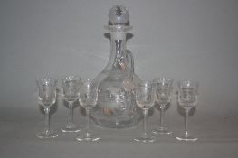 AN EARLY 20TH CENTURY ONION SHAPED DECANTER AND SIX LIQUEUR GLASSES, etched with designs of deer and