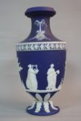 A LATE VICTORIAN BLUE JASPERWARE VASE, the neck applied with ribbons, wreath, torch and quiver,