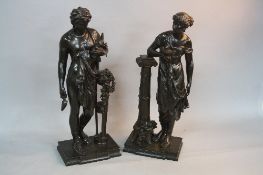 A PAIR OF BRONZE FIGURES AFTER DUMAIGE, classical male and female figures, she holding an oil lamp