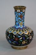 A LATE 19TH CENTURY FRENCH CLOISONNE SQUAT ONION SHAPED VASE, turquoise and black ground with flower