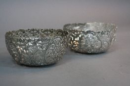 A PAIR OF LATE 19TH/EARLY 20TH CENTURY CHINESE EXPORT SILVER BOWLS, foliate pierced and chased