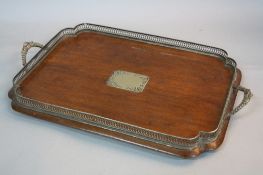 A LATE VICTORIAN OAK AND SILVER PLATED SHAPED RECTANGULAR GALLERY TRAY, cast twin handles, pierced