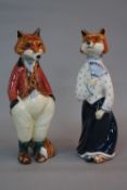 A PAIR OF RYE CINQUE PORTS POTTERY FIGURES OF FELICITY AND FREDDIE FOX, painted marks, heights