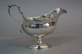 A GEORGE III SILVER SAUCE BOAT, 'S' scroll handle, on an oval pedestal, London 1784, approximate