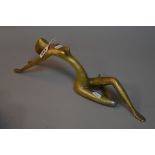 A CONTEMPORARY ABSTRACT BRONZED METAL FIGURE, of reclining nude lady, length approximately 41.5cm