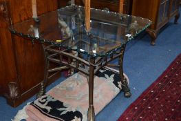 A METAL FRAMED COFFEE TABLE, with glass top