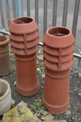 A PAIR OF LOUVRED TERRACOTTA CHIMNEY POTS, approximate height 92cm