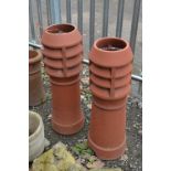 A PAIR OF LOUVRED TERRACOTTA CHIMNEY POTS, approximate height 92cm