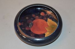 A MOORCROFT POTTERY LIPPED TRINKET DISH, Pomegranate on blue ground, impressed marks to base,