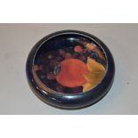 A MOORCROFT POTTERY LIPPED TRINKET DISH, Pomegranate on blue ground, impressed marks to base,