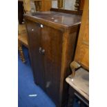 AN OAK TALLBOY, a walnut chest of drawers and an oak fireside chair (3)