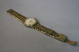 A 9CT MARVIN WATCH HEAD, on a plated strap