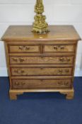 A GEORGE III STYLE OAK AND MAHOGANY BANDED CHEST, of two short and three long graduated drawers,