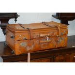 A TAN LEATHER TRAVELLING SUITCASE, approximate size length 70cm x depth 36cm x height 29cm