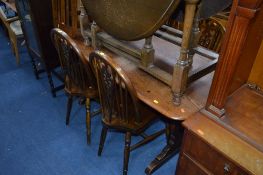 AN OAK REFECTORY TABLE, with four wheelback chairs and two others (7)