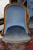 A VICTORIAN CARVED WALNUT BEDROOM CHAIR, with blue upholstery