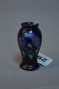 A MINIATURE MOORCROFT POTTERY VASE, 'Pansy' pattern, (possibly a tradesman sample), approximate