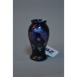 A MINIATURE MOORCROFT POTTERY VASE, 'Pansy' pattern, (possibly a tradesman sample), approximate