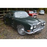 A JAGUAR 420 IN BRITISH RACING GREEN, first registered 1968, mileage shown 83493 (some body damage),