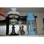 A LATE VICTORIAN BLUE GLASS LUSTRE, an oil lamp, a 19th Century glass jug with gilt metal overlay