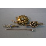 A PIN BROOCH, bar brooch, knot brooch and target brooch (4)