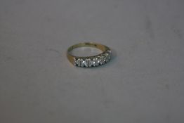 A 9CT SEVEN STONE DIAMOND RING, ring size N, approximate weight 2.8 grams