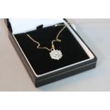 A 9CT NECKLACE WITH FLOWER PENDANT