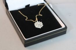 A 9CT NECKLACE WITH FLOWER PENDANT