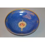 A ROYAL WORCESTER FOOTED BOWL, central roundel of fruit, No 2769, black backstamp (restorations)