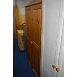 A PINE DOUBLE DOOR WARDROBE