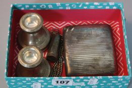 A SILVER CIGARETTE CASE, two silver dwarf candlesticks, cheroot holder (intact)