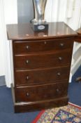 AN EDWARDIAN MAHOGANY BOWFRONT CHEST, of four graduated long drawers, stamped Waring & Gillow London