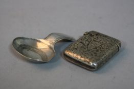 A VICTORIAN SILVER VESTA CASE, Birmingham 1894 and a Georgian silver caddy spoon, Birmingham 1816