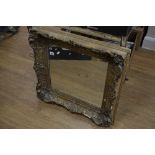 A GILT FRAMED WALL MIRROR, a small stool and a pair of bellows with stud work design (3)